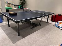 Overall view of Stiga Spark table tennis table unfolded with net attached