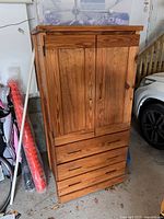 Full view of wood armoire front