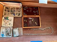 Drawer view with multiple trays of costume jewelry