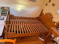 Full view of pine bed frame with slat base installed