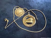 Chain and both pendants on black background