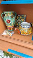 All pottery pieces together on shelf