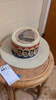 Full view of plastic JFK campaign hat on table