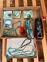 Overview of all jewelry pieces in cardboard tray