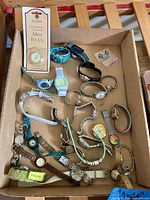 Box of assorted wristwatches, clock insert card and spare strap