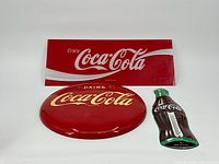 All three Coca-Cola pieces displayed together