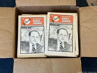 Box with stack of Giants Journal newspapers showing Bob Lurie cover