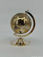 Full view of Neiman Marcus calendar globe on stand
