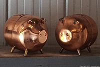 front view of both copper piggy banks