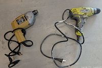 Both corded drills with cords extended