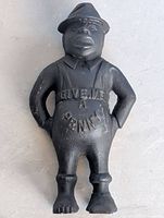 Front view showing full figure and raised lettering