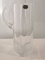 Full view of clear crystal jug with handle
