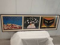 Full view of framed triple print artwork