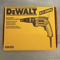 Front of factory box showing DeWalt DW252 drywall screwdriver, 6.0 amps rating.