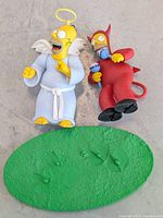 Front view angel and devil Homer figures with base
