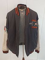 Full front view of varsity jacket on hanger