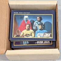 Open box showing stacked Star Trek cards, top card Whom Gods Destroy