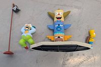 All items laid out: Krusty, Bart, totem pole, flag pole, platform
