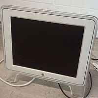 Front view showing screen, acrylic frame, stand
