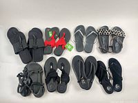Group view showing all nine pairs of sandals