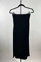 Full front view of black Edwin Birch strapless silk dress on hanger