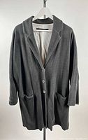 Front view of gray coat on hanger showing overall style, buttons and pockets
