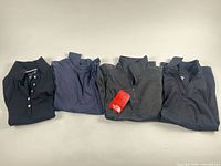 All four tops laid side by side