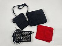 Four clutches laid out to show size and style differences