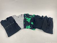 All five folded tops side by side