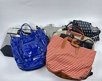 Group shot of eight assorted beach bags showing variety of colours and patterns