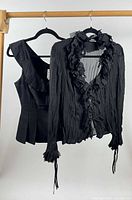 Both tops hanging on rack front view