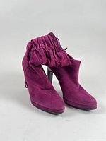 Full view of both boots showing slouch design and color