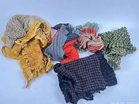 Group of six scarves showing assorted textures and colors