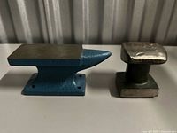 Mini blue bench anvil and green toe dolly side by side