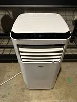 Front view of unit showing control panel and vent grille