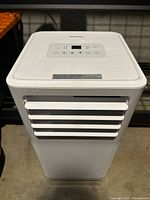 Full view of Danby portable air conditioner showing front louvers and top controls