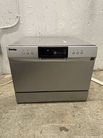 Front view of Danby countertop dishwasher showing controls and stainless exterior