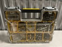 Front view of clear-lid DeWALT organizer filled with assorted hardware