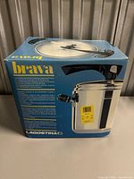Retail box showing Lagostina Brava pressure cooker image and branding