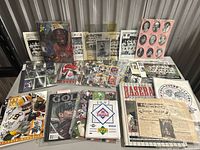 Overall view of all sports memorabilia items spread on table