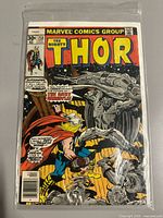 Front cover of The Mighty Thor #258 in bag with tear bottom right