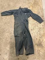 Full view of coveralls laid flat showing overall design