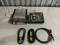 Overall view of both control boxes and three cables