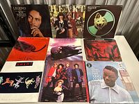 Nine LPs including Bob Marley Legend, Heart, Deep Purple, Genesis, Nat King Cole