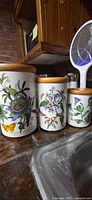 Three Portmeirion Botanic Garden canisters on counter