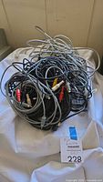 Pile of assorted gray and black cables with various connectors