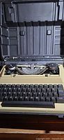 Typewriter inside open hard case