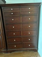 Front view showing all 10 drawers and merlot finish