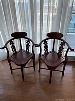 Both Chinese corner chairs side by side showing overall design and finish