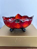 Oblique view showing bowl shape, exterior glaze and maker label